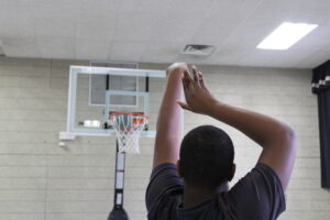 the gatway school student learning to play in gym