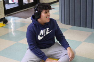 the gateway school student relaxing in gym