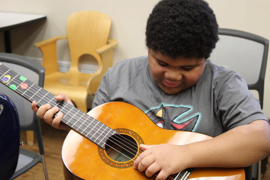 happy music student at the gateway school for special needs